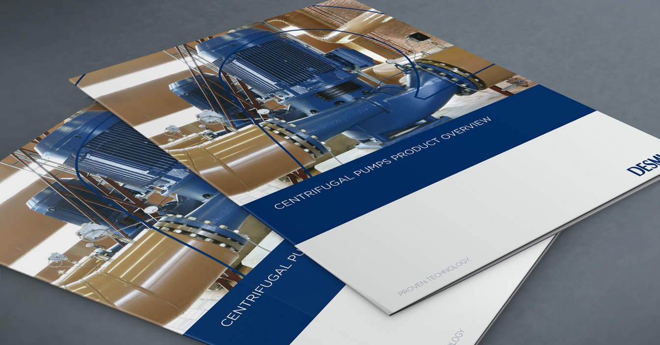 DESMI brochure featuring centrifugal pumps for fluid handling on a gray surface.