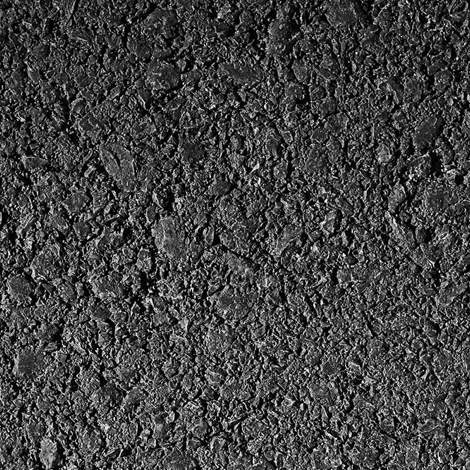 Close-up of rough black asphalt texture with visible granules and stones.